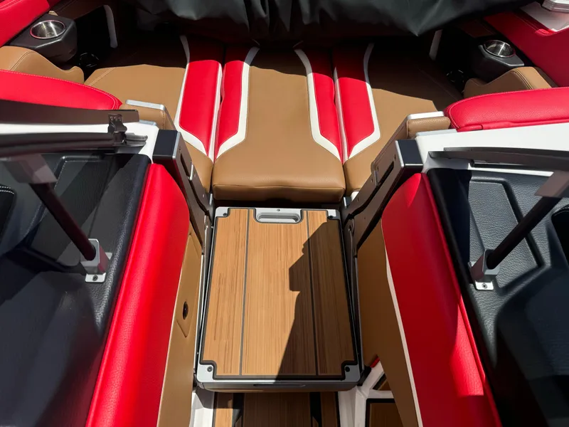 Slide: The Image of 2023 Supra SL 550 interior with red and brown leather seats and wood accents. - 11