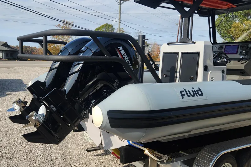 Slide: The Image of 2025 Fluid Watercraft Patrol 26 with dual Mercury engines on trailer. - 5