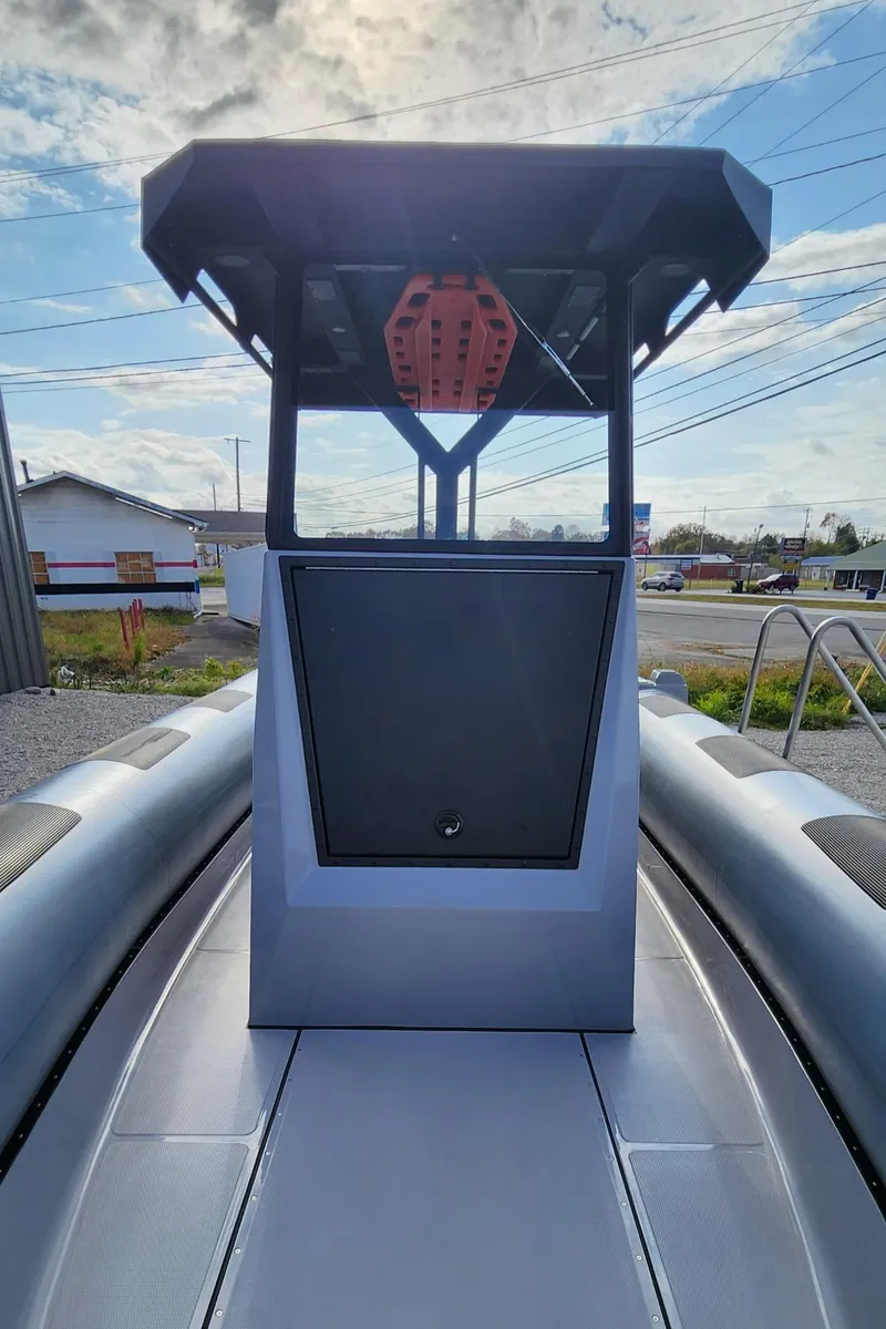 Slide: The Image of 2025 Fluid Watercraft Patrol 26 boat, front view, with sleek design and modern features. - 7