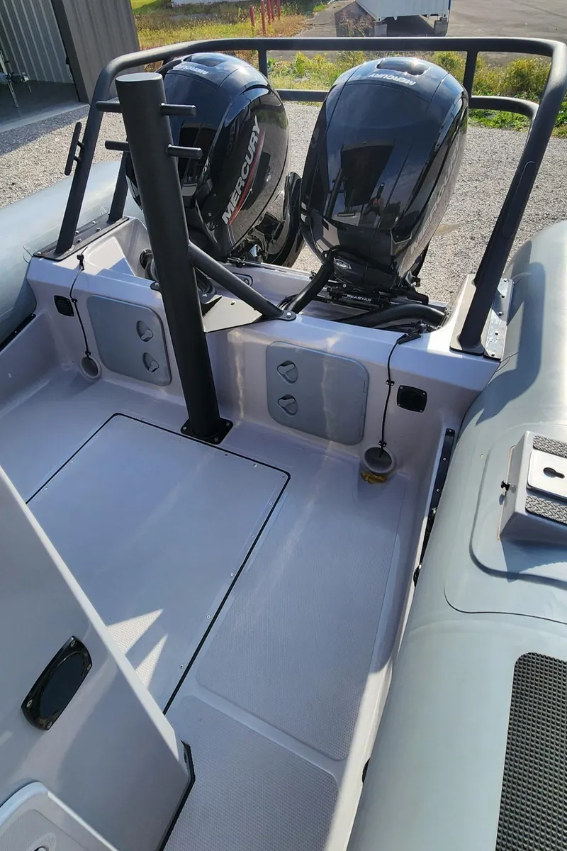 Slide: The Image of 2025 Fluid Watercraft Patrol 26 boat with dual Mercury outboard engines. - 9