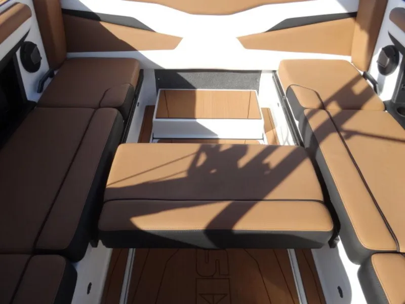 Slide: The Image of 2025 Axis T235 boat interior with brown seating and modern design. - 13