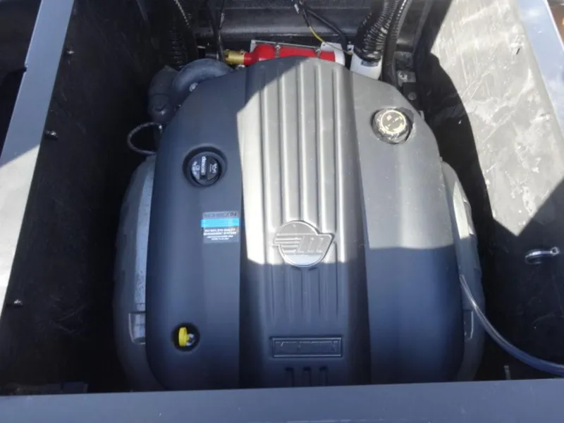 Slide: The Image of Engine compartment of 2025 Axis T235 boat, showcasing engine components and design. - 14