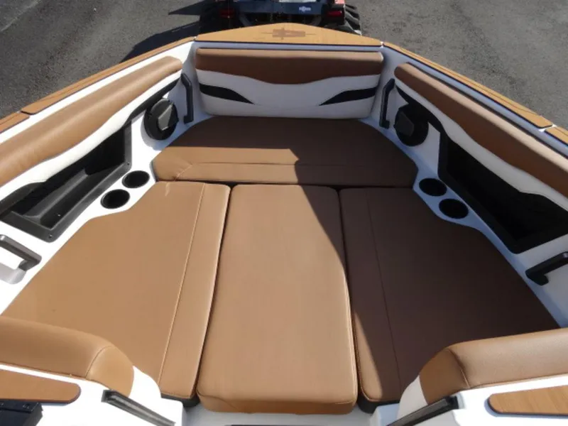 Slide: The Image of 2025 Axis T235 boat interior with tan seating and cup holders. - 17