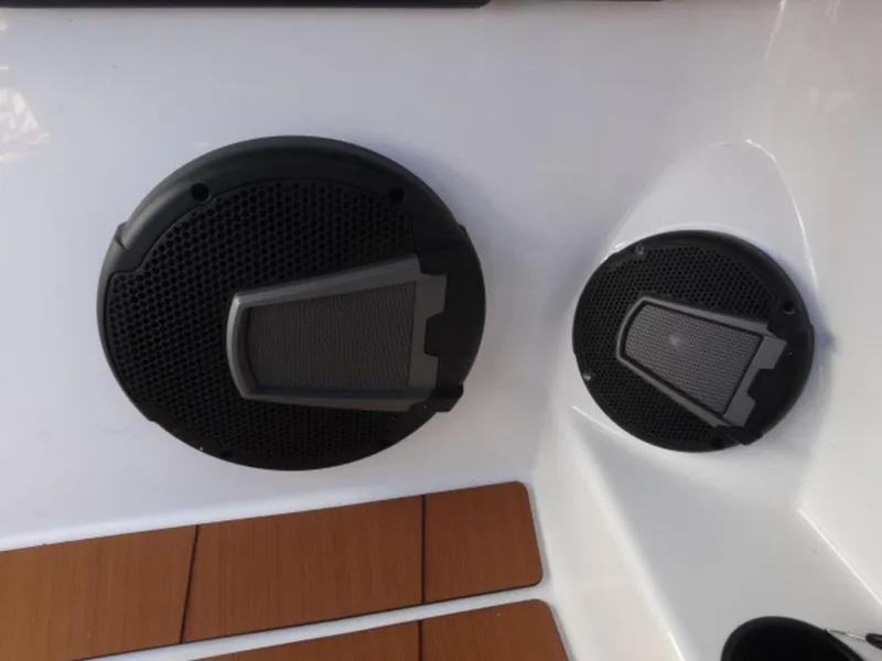 Slide: The Image of Boat speakers on Axis T235, 2025 model, with sleek black design and wood accents. - 21
