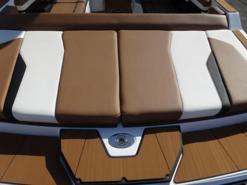 Slide: The Image of 2025 Axis T235 boat with brown and white cushioned seating. - 4