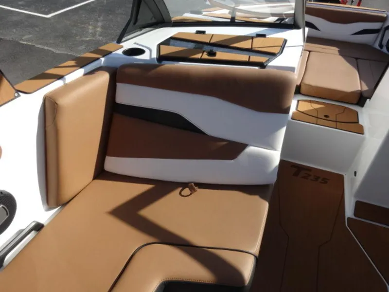 Slide: The Image of 2025 Axis T235 boat interior with brown and white seating, modern design. - 6