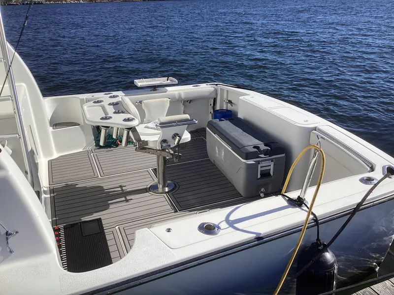 Slide: The Image of 2006 Henriques 35 Flybridge boat deck with fishing chair and cooler. - 15