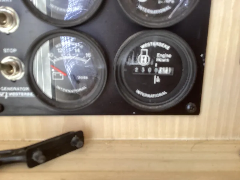 Slide: The Image of Close-up of Henriques 35 Flybridge 2006 engine gauges showing 2300 hours. - 17