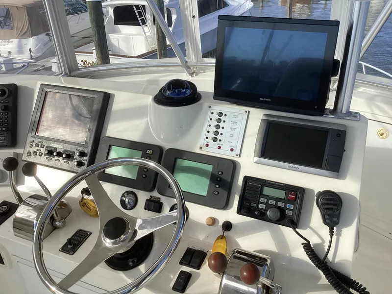 Slide: The Image of Control panel of a 2006 Henriques 35 Flybridge boat with navigation equipment. - 23