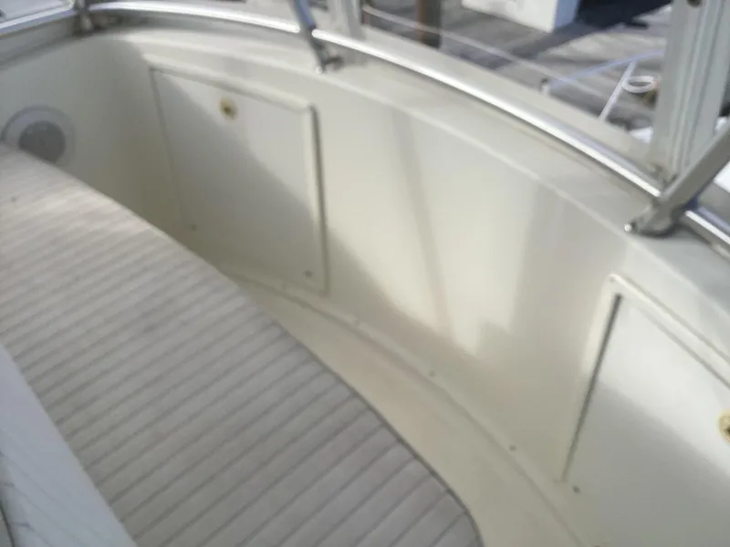 Slide: The Image of Henriques 35 Flybridge 2006 boat interior with seating and storage compartments. - 25