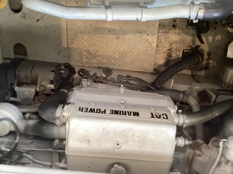 Slide: The Image of CAT Marine Power engine in a 2006 Henriques 35 Flybridge boat. - 33