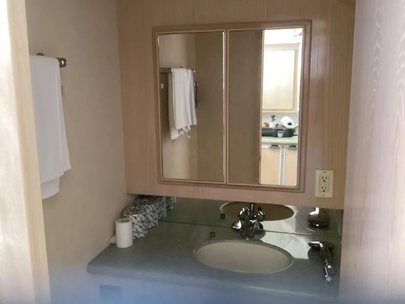 Slide: The Image of Bathroom vanity with mirror in 2006 Henriques 35 Flybridge yacht. - 8
