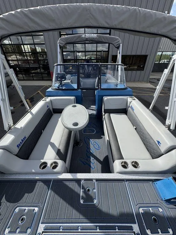 Slide: The Image of 2025 SeaArk Super Lounge Easy boat interior with seating and table. - 12