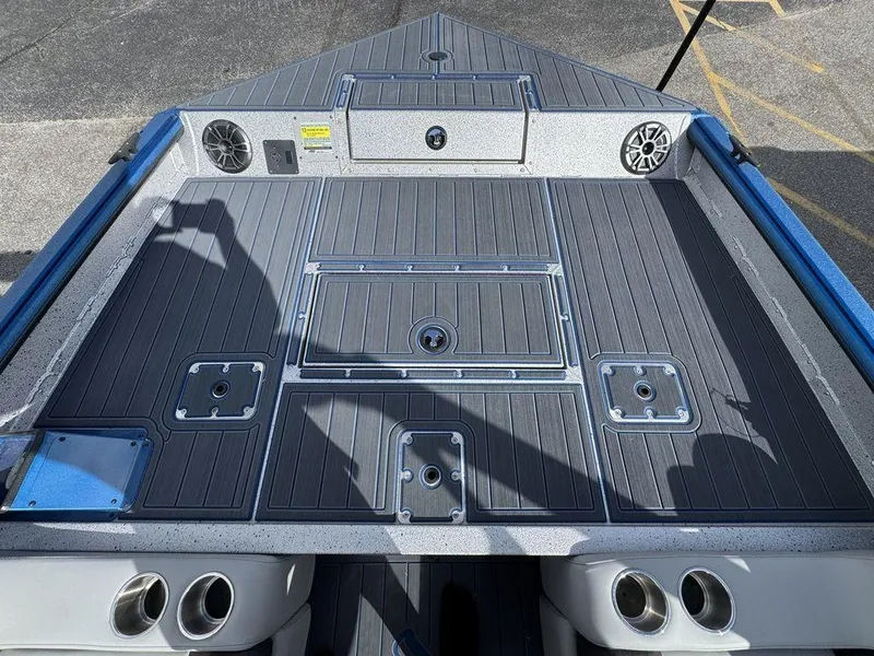 Slide: The Image of 2025 SeaArk Super Lounge Easy boat deck with storage compartments and speakers. - 13