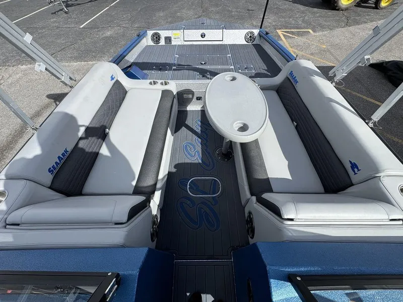 Slide: The Image of 2025 SeaArk Super Lounge Easy boat interior with seating and table. - 15