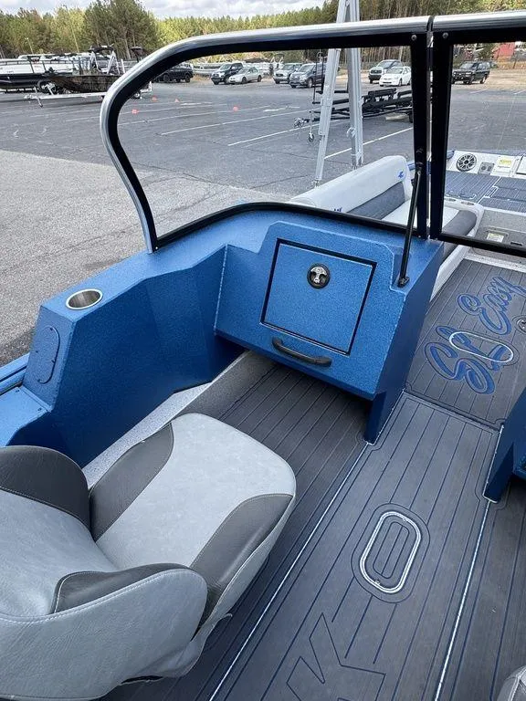 Slide: The Image of 2025 SeaArk Super Lounge Easy boat interior with blue seating and modern design. - 17