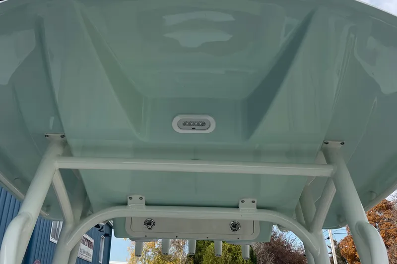 Slide: The Image of 2025 Cobia 220 Center Console boat's T-top underside view. - 5