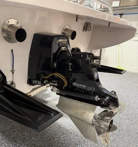 Slide: The Image of 2019 Phantom SV 32 boat with Mercury Racing XR outdrive in a garage. - 3