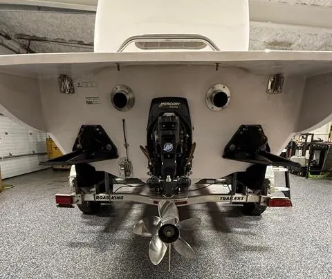 Slide: The Image of Rear view of 2019 Phantom SV 32 boat on trailer in garage. - 4