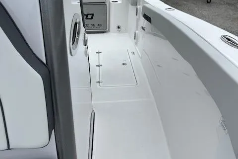 Slide: The Image of 2025 Sea Pro 262 Sport boat interior, featuring sleek white deck and modern design. - 13