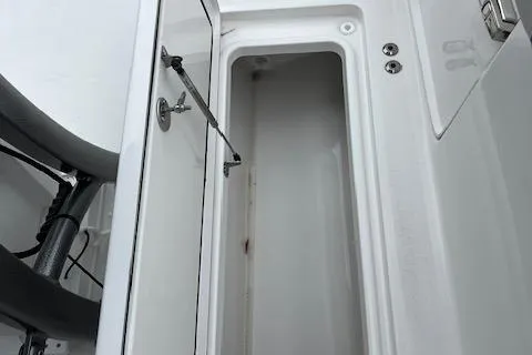Slide: The Image of 2025 Sea Pro 262 Sport storage compartment, open and empty. - 19