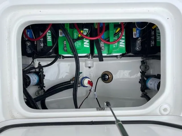 Slide: The Image of Battery compartment of 2025 Sea Pro 262 Sport boat, showing wiring and components. - 20