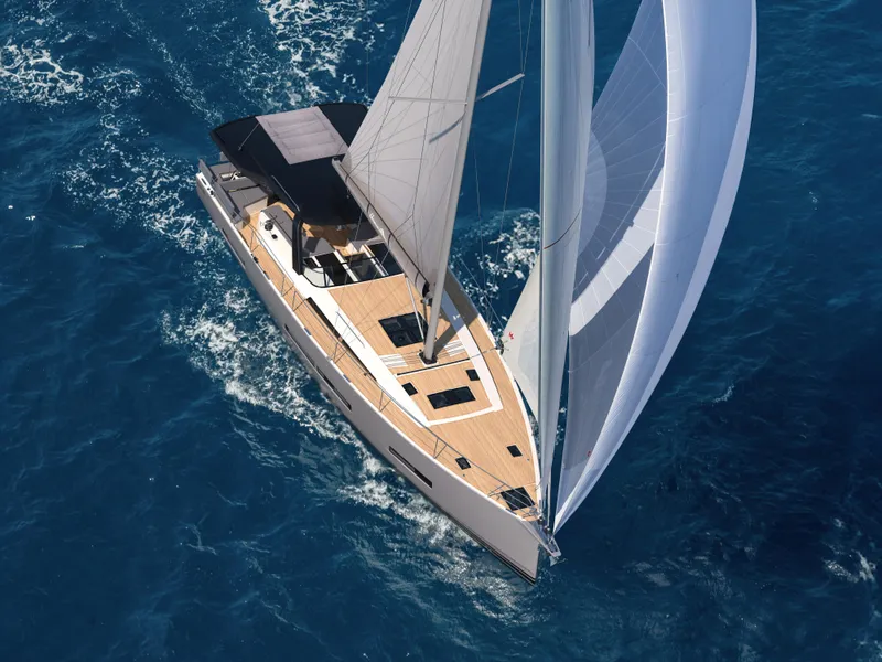 Slide: The Image of Aerial view of 2025 Hanse 590 yacht sailing on blue ocean waters. - 4