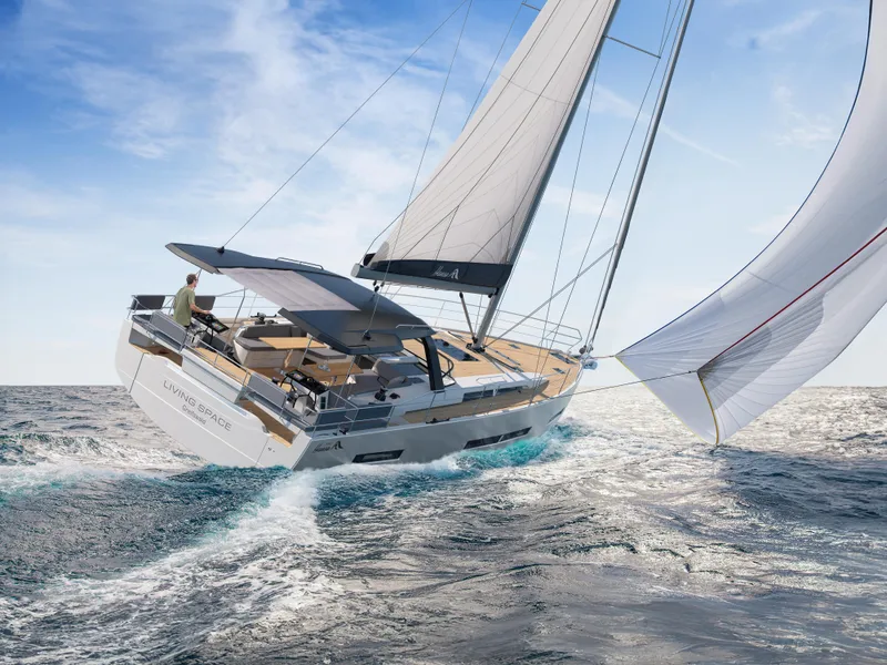 Slide: The Image of 2025 Hanse 590 yacht sailing on open sea with full sails. - 40