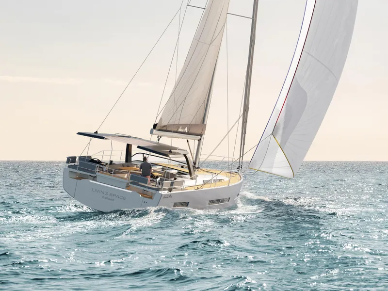 Slide: The Image of 2025 Hanse 590 yacht sailing on open sea under clear skies. - 42