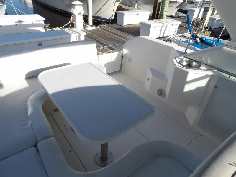 Slide: The Image of 1998 Wellcraft Martinique 3600 boat interior with seating and table. - 13
