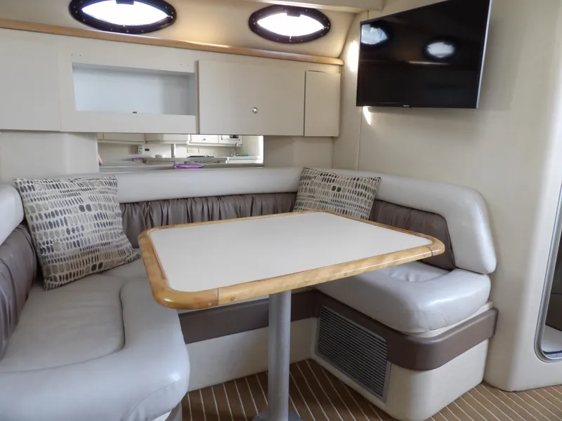 Slide: The Image of 1998 Wellcraft Martinique 3600 interior with cozy dining area and modern decor. - 22
