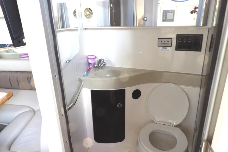 Slide: The Image of 1998 Wellcraft Martinique 3600 yacht bathroom with sink and toilet. - 27