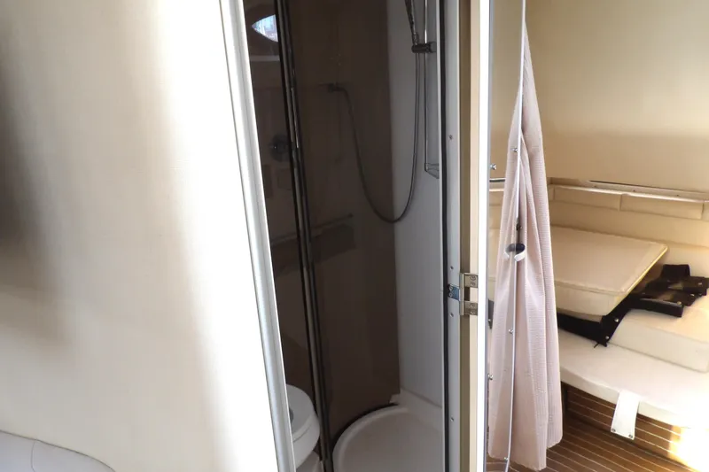 Slide: The Image of 1998 Wellcraft Martinique 3600 interior with shower and seating area. - 28