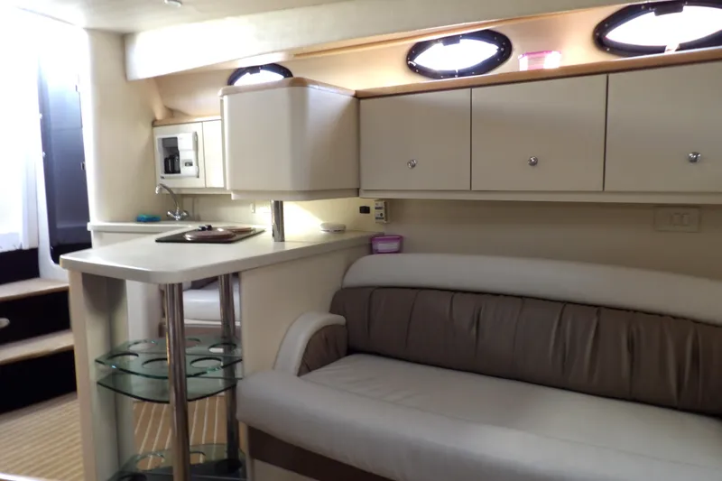 Slide: The Image of 1998 Wellcraft Martinique 3600 interior with modern kitchen and comfortable seating. - 31