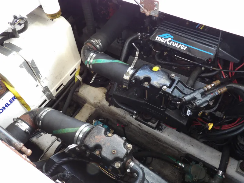 Slide: The Image of Engine compartment of 1998 Wellcraft Martinique 3600 with MerCruiser components. - 39