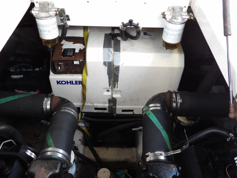 Slide: The Image of 1998 Wellcraft Martinique 3600 engine compartment with Kohler generator and fuel filters. - 42