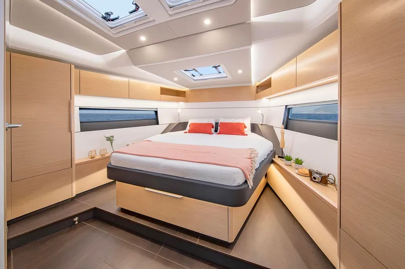 Slide: The Image of Luxurious 2025 Hanse 510 yacht bedroom with modern design and natural wood finishes. - 14