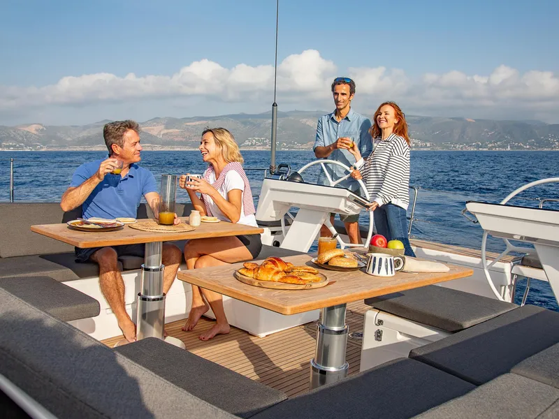 Slide: The Image of People enjoying breakfast on a 2025 Hanse 510 yacht, with ocean views. - 17
