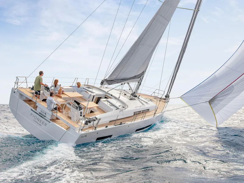 Slide: The Image of 2025 Hanse 510 yacht sailing on open sea with people on deck. - 22
