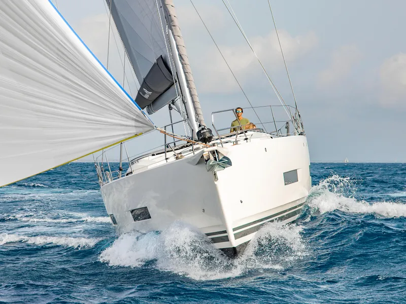 Slide: The Image of 2025 Hanse 510 yacht sailing on open sea with white sails. - 25