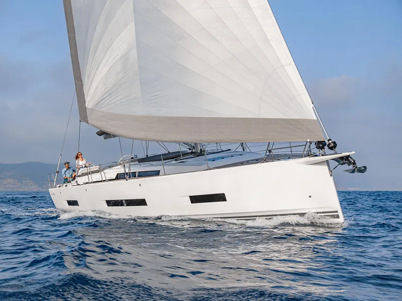 Slide: The Image of 2025 Hanse 510 yacht sailing on open sea under clear skies. - 26