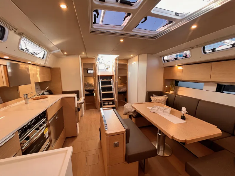 Slide: The Image of Luxurious interior of 2025 Hanse 460 yacht with modern kitchen and dining area. - 10