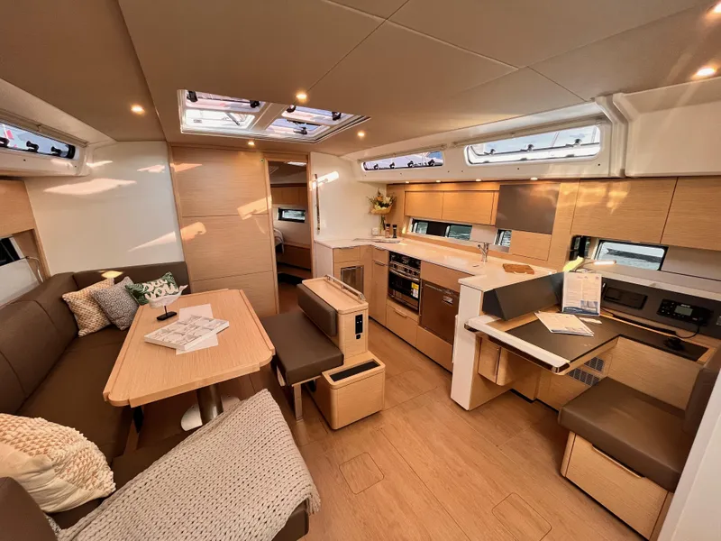 Slide: The Image of Luxurious interior of 2025 Hanse 460 yacht with modern kitchen and seating area. - 11