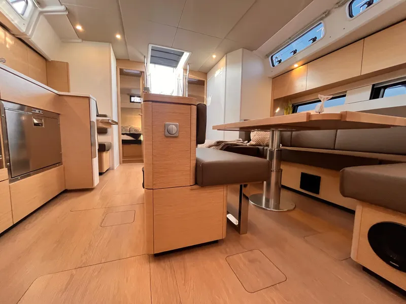 Slide: The Image of Luxurious interior of 2025 Hanse 460 yacht with modern kitchen and dining area. - 14