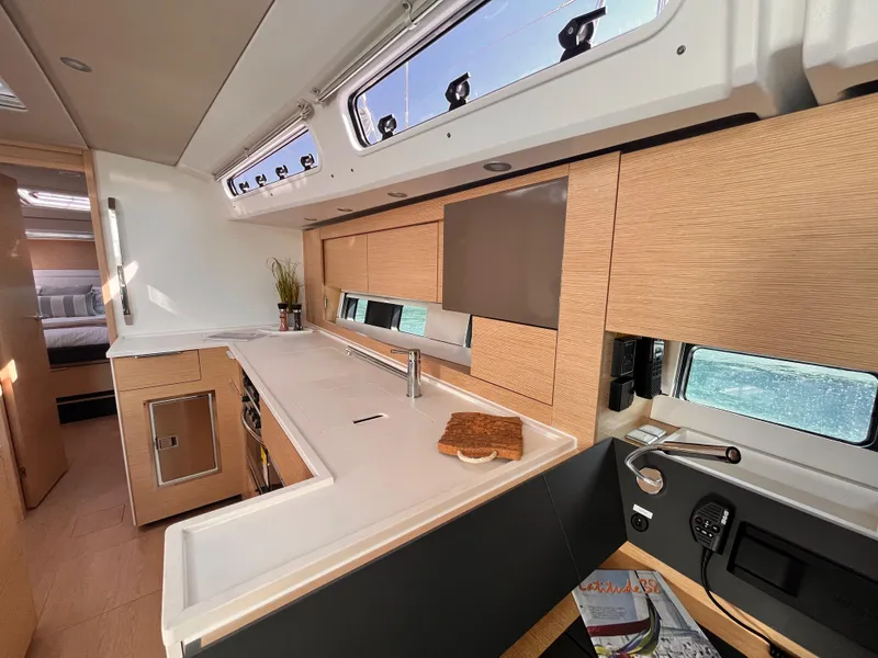 Slide: The Image of Modern kitchen interior of 2025 Hanse 460 yacht with sleek design and ample natural light. - 16