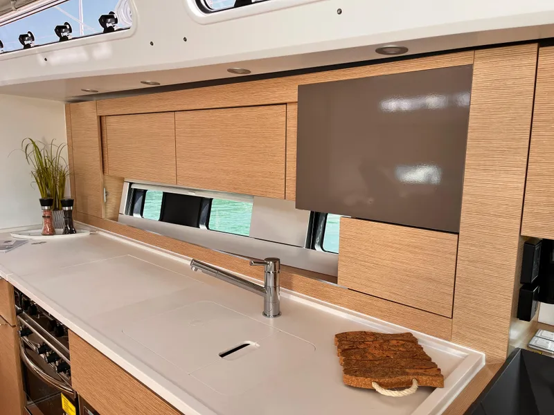 Slide: The Image of Modern kitchen interior of 2025 Hanse 460 yacht with sleek cabinetry and countertop. - 17