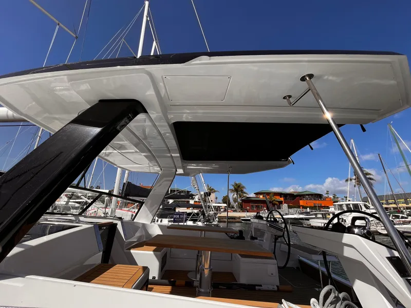 Slide: The Image of Modern 2025 Hanse 460 yacht with sleek design and spacious deck at marina. - 2