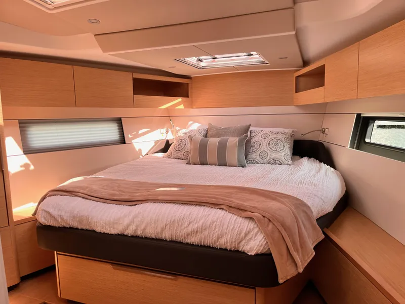Slide: The Image of Luxurious bedroom interior of 2025 Hanse 460 yacht with modern design and cozy bedding. - 24