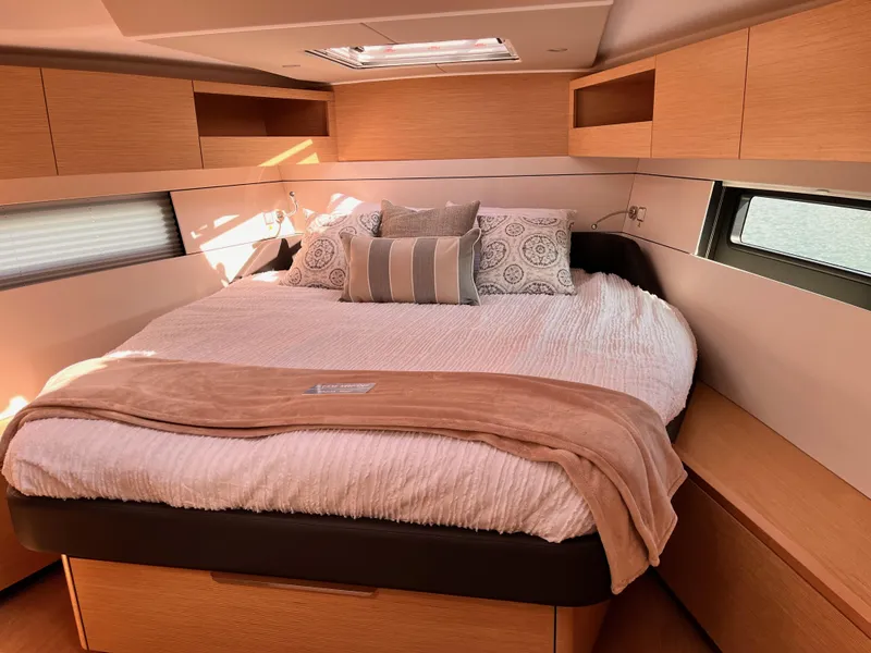 Slide: The Image of Luxurious bedroom interior of 2025 Hanse 460 yacht with cozy bedding and modern design. - 25
