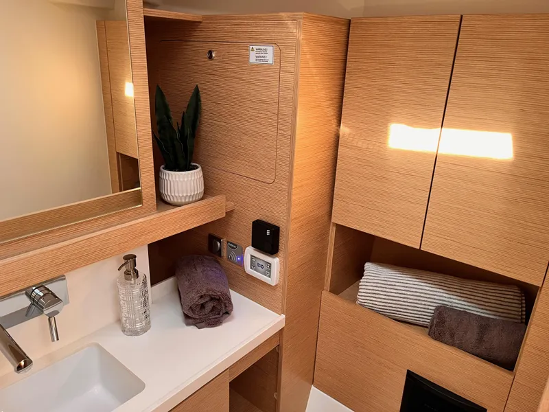 Slide: The Image of Modern bathroom interior of 2025 Hanse 460 yacht with wooden cabinetry and sleek fixtures. - 28